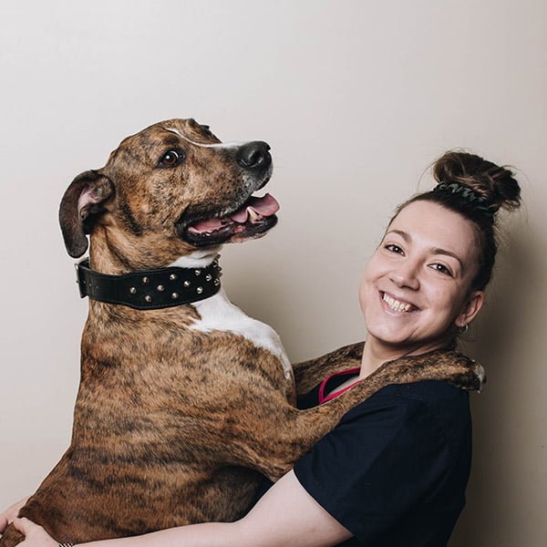 Mitcham pet hospital staff hugging her dog